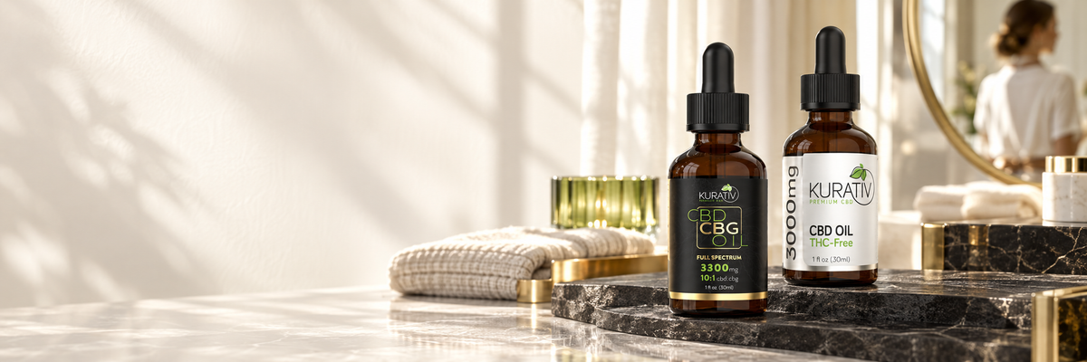 Kurativ full-spectrum CBD CBG oil and THC-free CBD oil on a sunlit stone vanity