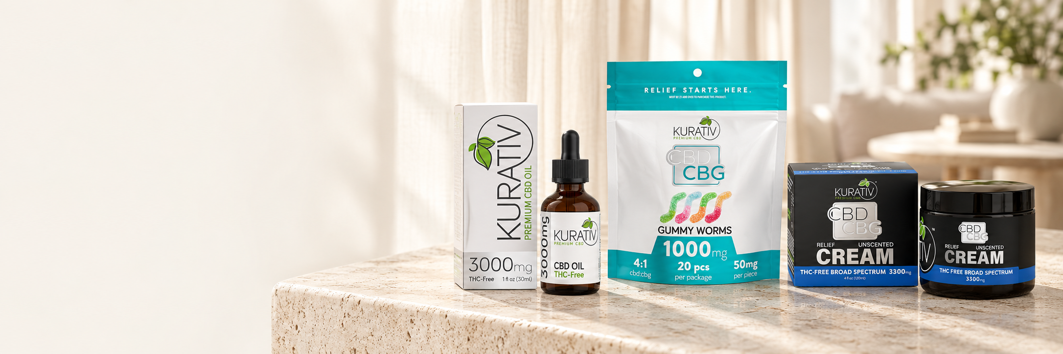 THC-free CBD oil, CBG gummy worms and broad-spectrum CBD CBG cream in a bright home setting