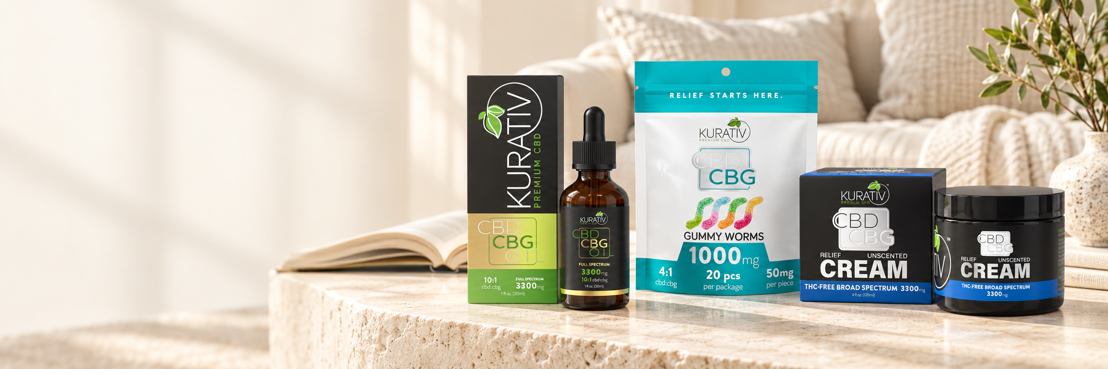 Kurativ Premium CBD full-spectrum CBD CBG oil, THC-free CBG gummies and broad-spectrum CBD CBG cream on a sunlit coffee table